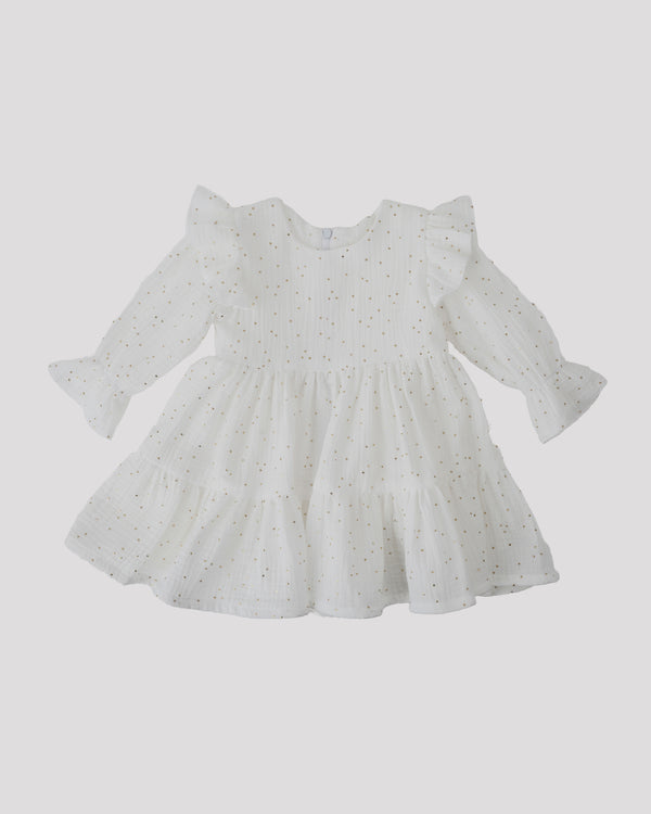 A white dress with ruffled sleeves and a ruffled collar, featuring a polka dot pattern.