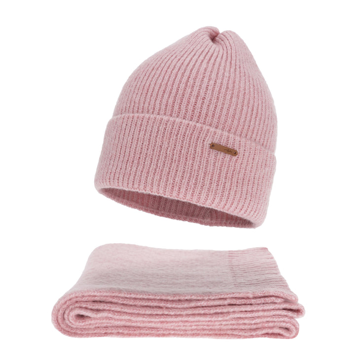 A pink knit beanie and a folded pink blanket are shown against a white background.