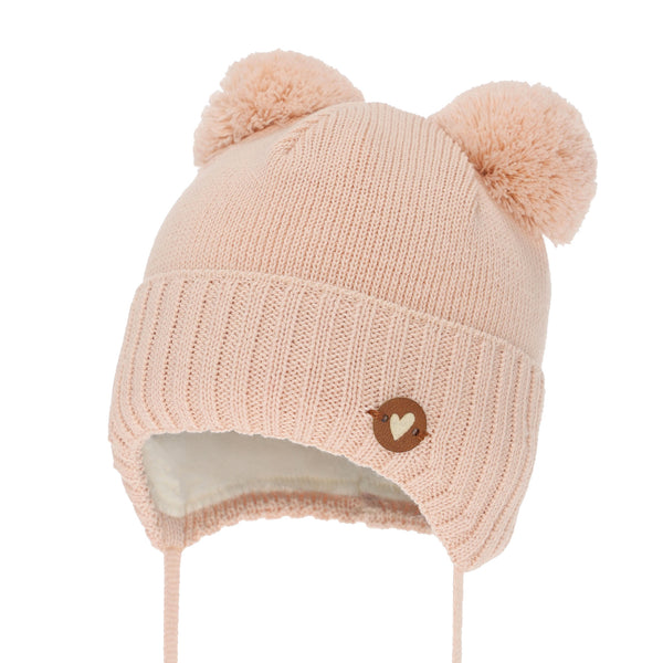 A pink knit beanie with pom poms on the ears and a heart-shaped button on the front.