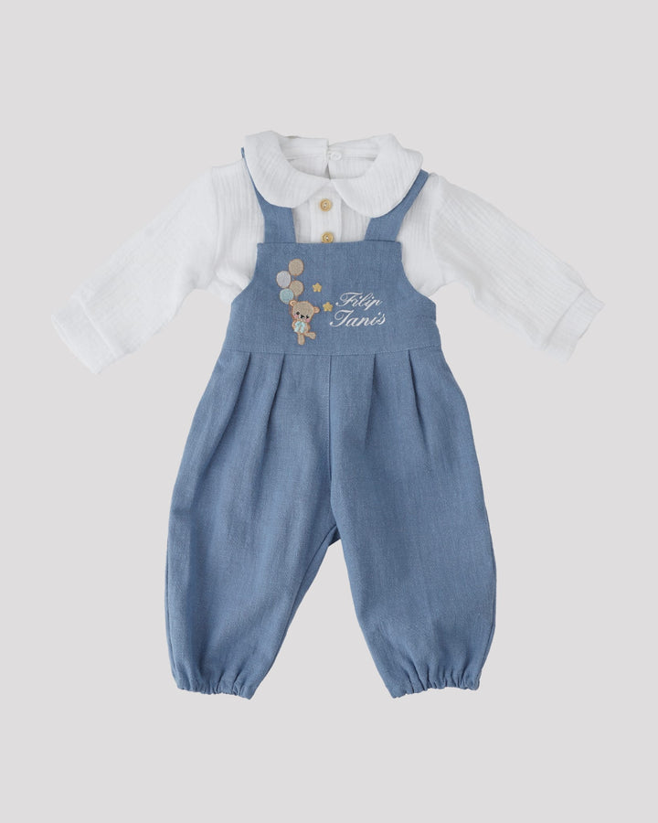 A blue jumpsuit with a white shirt underneath, featuring a cartoon character on the front.