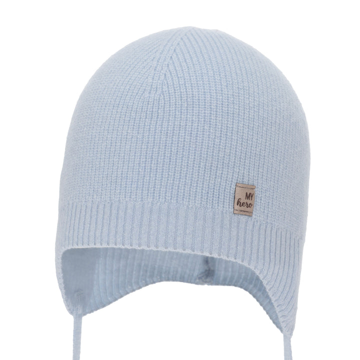 A light blue knitted hat with a small label on the front.