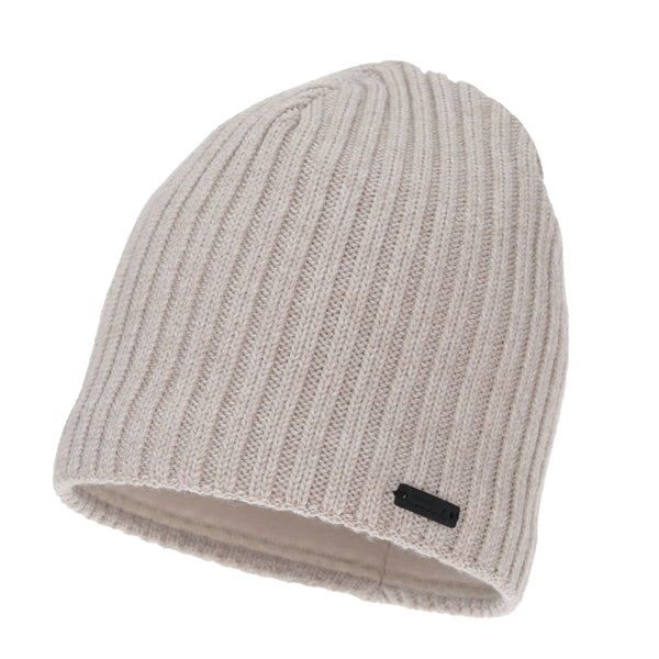A beige knitted beanie with a black tag attached to it.