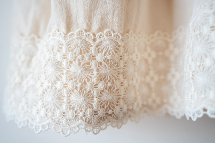 a close up of a white shirt on a hanger
