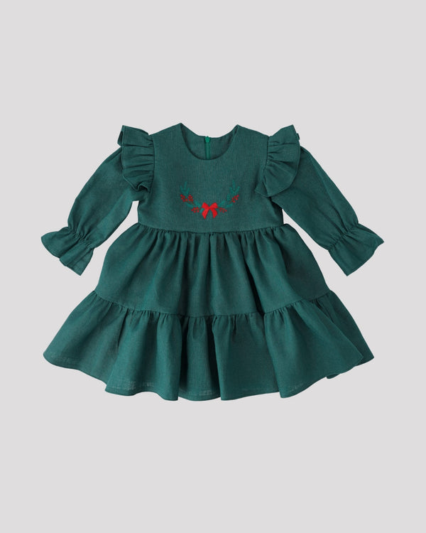 A green dress with ruffled sleeves and a ruffled collar, featuring a red bow on the front.