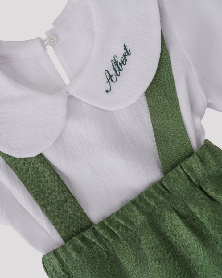 A white shirt with a green collar and suspenders, with the name "Althea" embroidered on the collar.