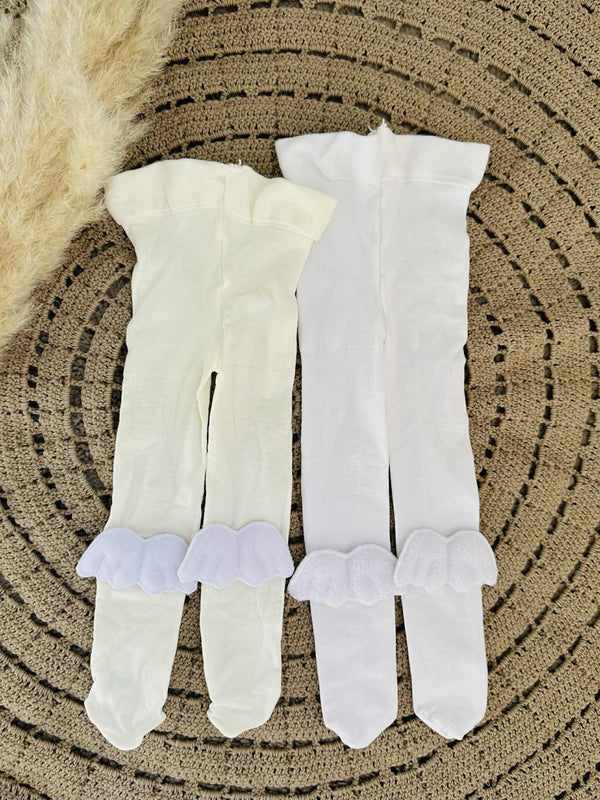 a pair of white tights lying on a circular woven surface.