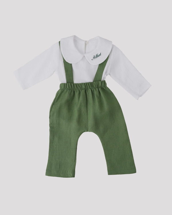 A white shirt with a green collar and suspenders, along with green pants, is displayed against a white background.