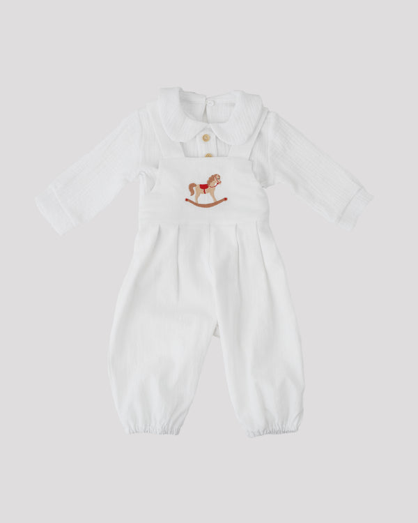 A white onesie with a small embroidered image of a rocking horse on the front.