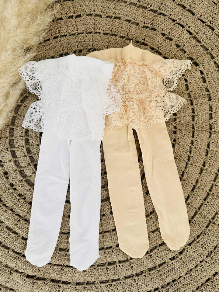 two pairs of white and beige tights lying on a circular patterned surface.