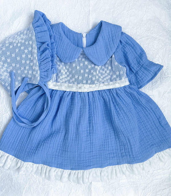 A blue lace dress with a ruffled collar and lace trim, featuring a ruffled hemline and a ruffled skirt.