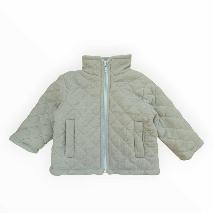 A light gray quilted jacket with a zipper and two pockets.