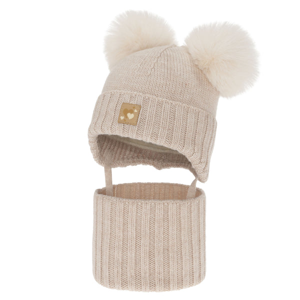 A beige knitted hat with pom poms on top and a matching beige knitted scarf.