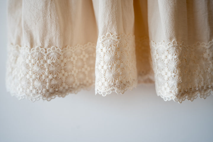 a close up of a curtain with lace on it
