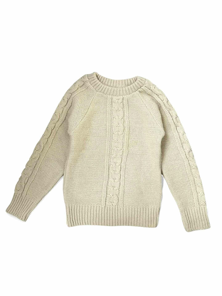 A cream-colored, knitted sweater with a ribbed collar and long sleeves, displayed against a white background.