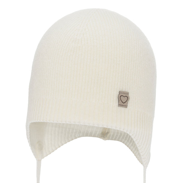 A white knit hat with a small heart-shaped patch on the front.