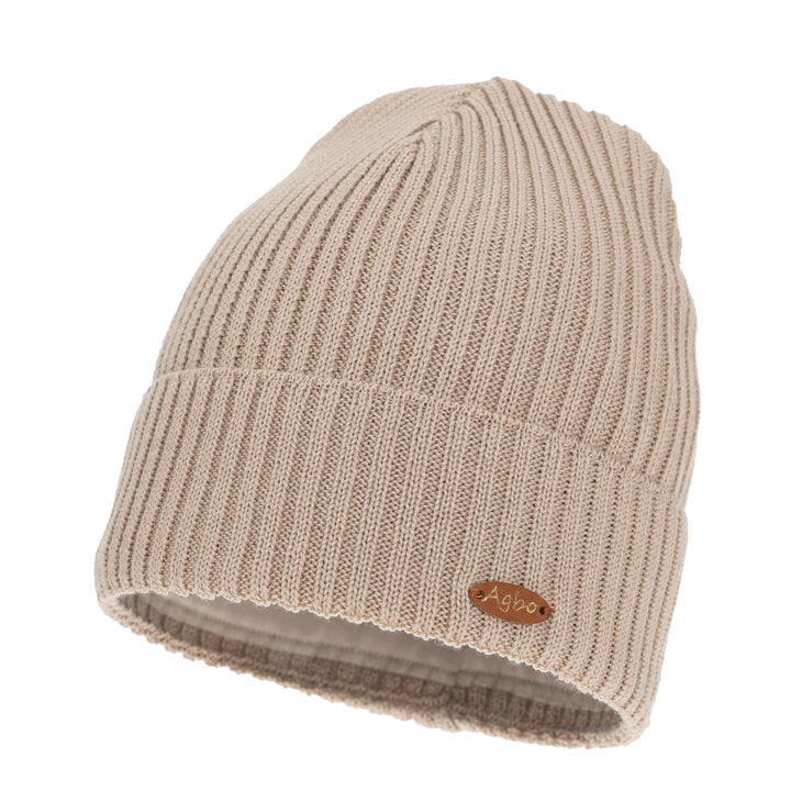 A beige knit beanie with a ribbed texture and a small brown tag on the front.